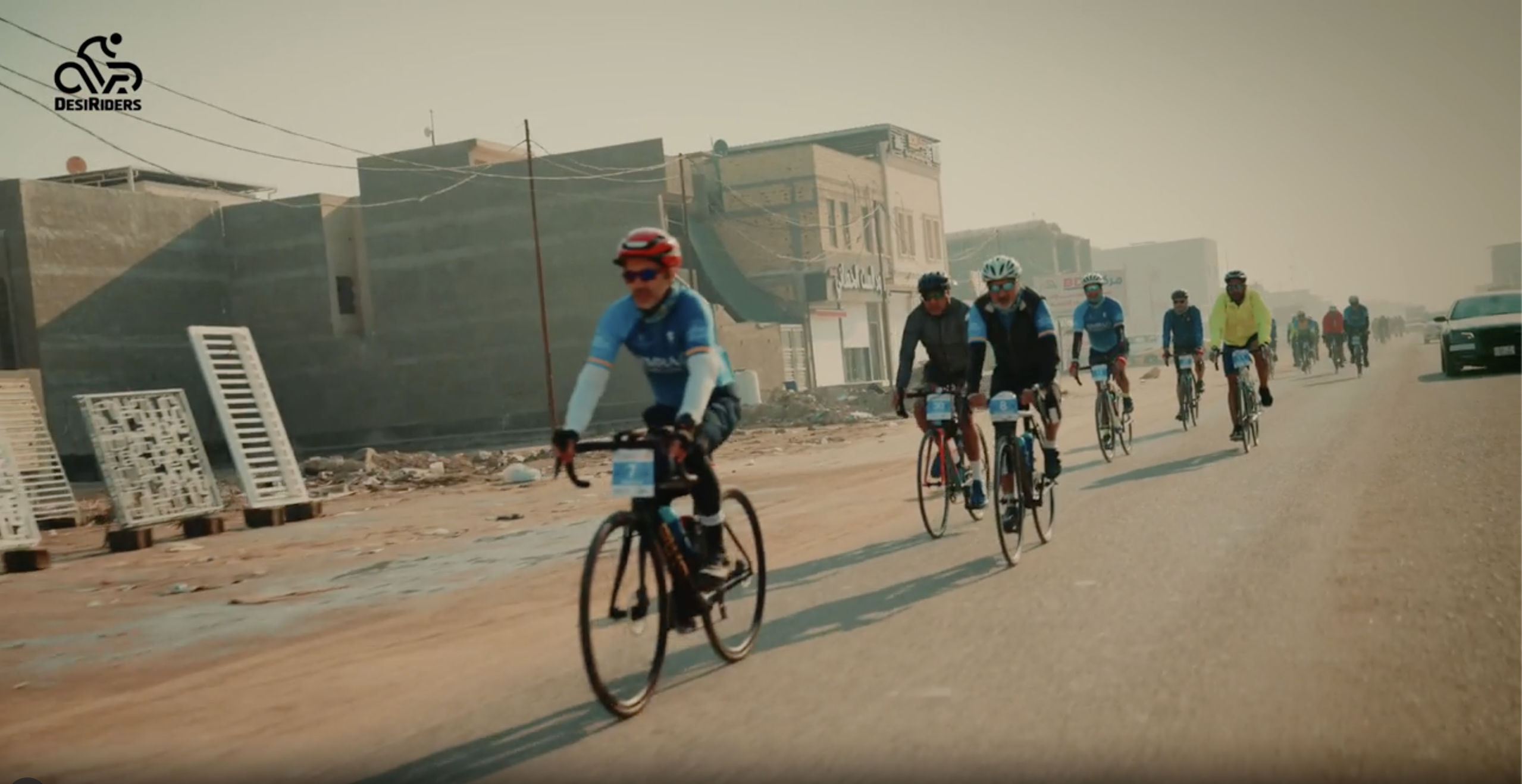 Zaheer in red helmet leading DesiRiders cyclists on the Basrah to Karbala ride